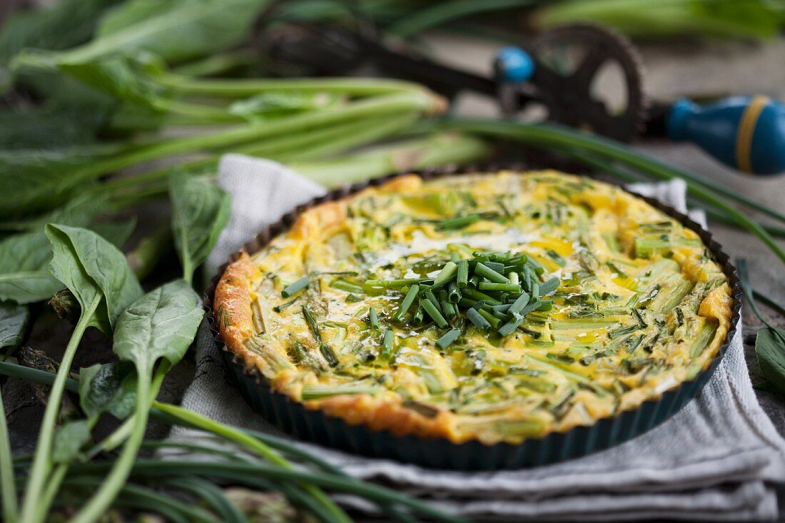 Egg cake with green asparagus and chives