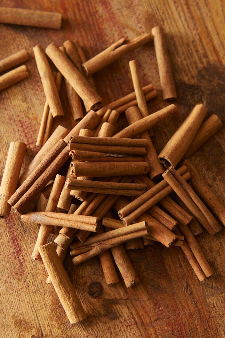 Cinnamon sticks on a wooden surface