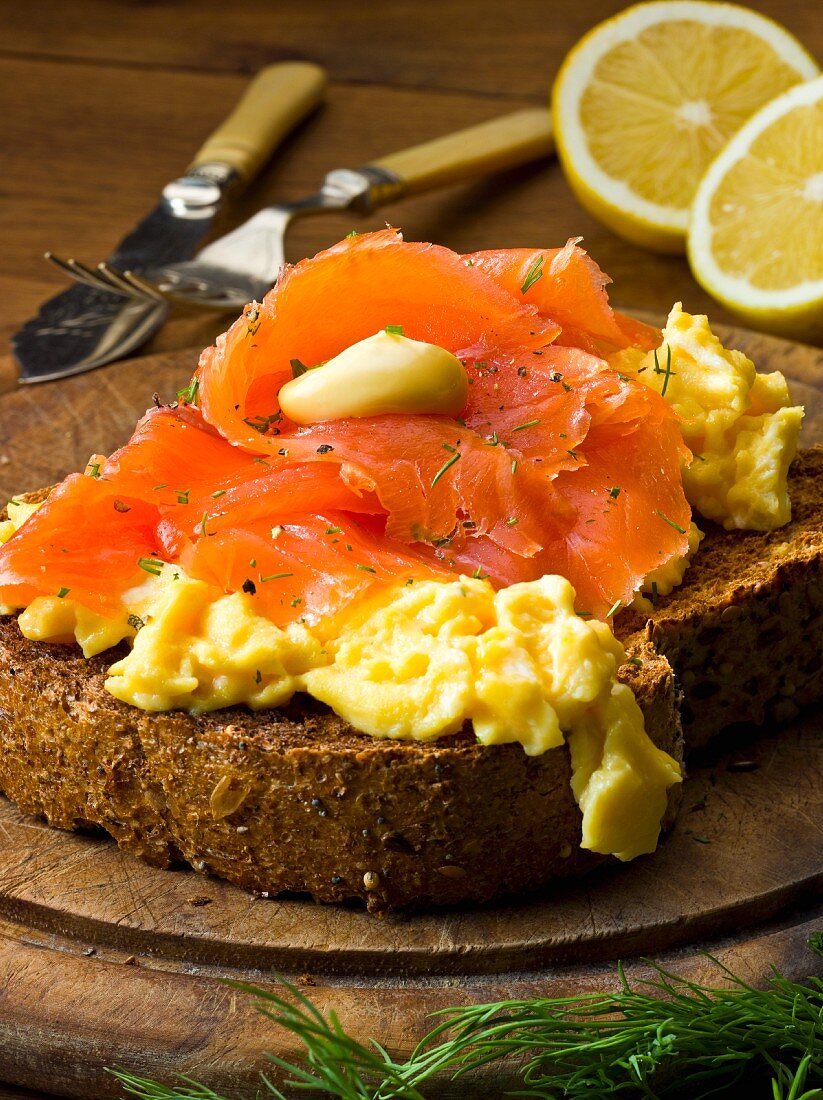 Wholemeal bread topped with smoked salmon and scrambled egg