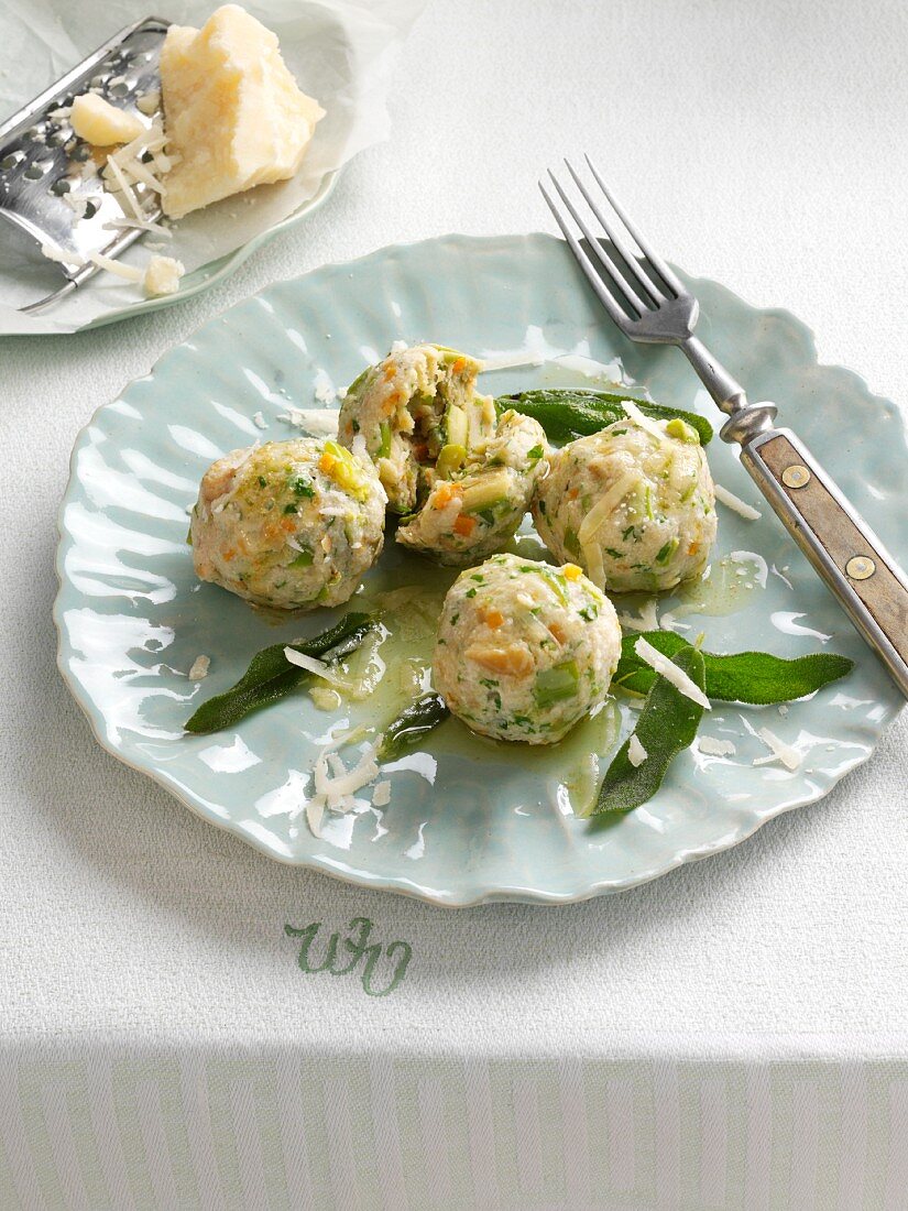 Asparagus dumplings with sage butter and parmesan cheese