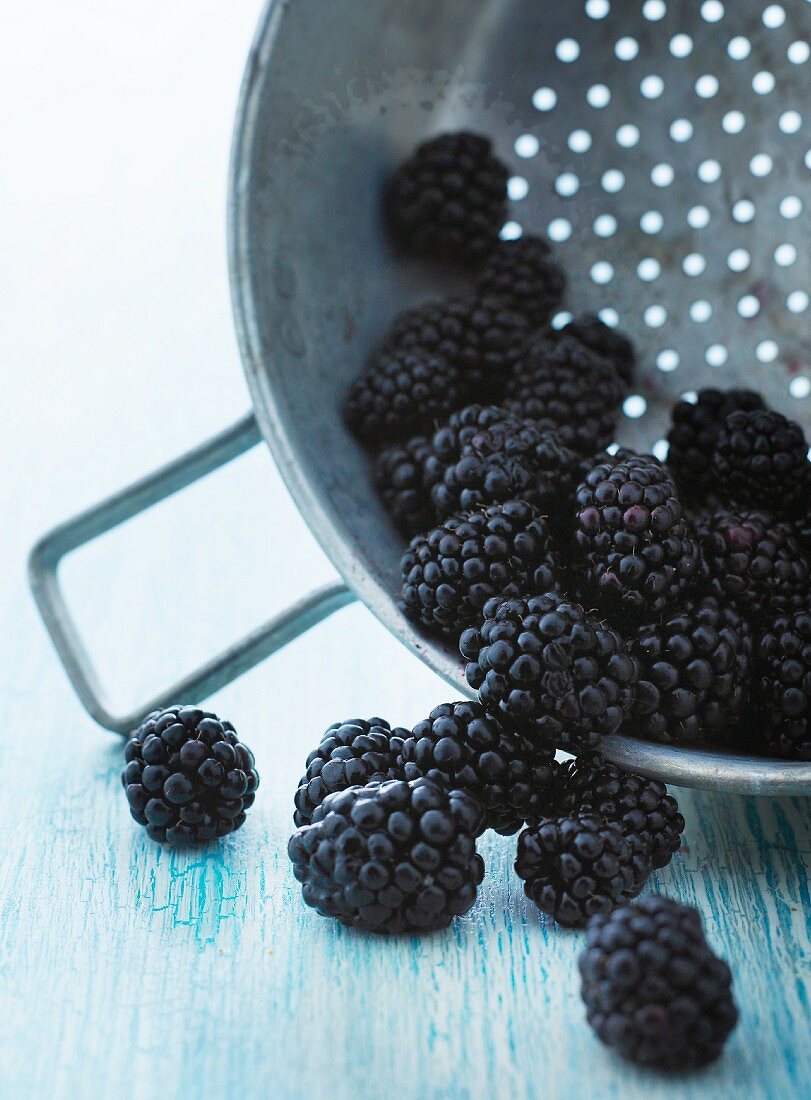 Fresh blackberries in a colander