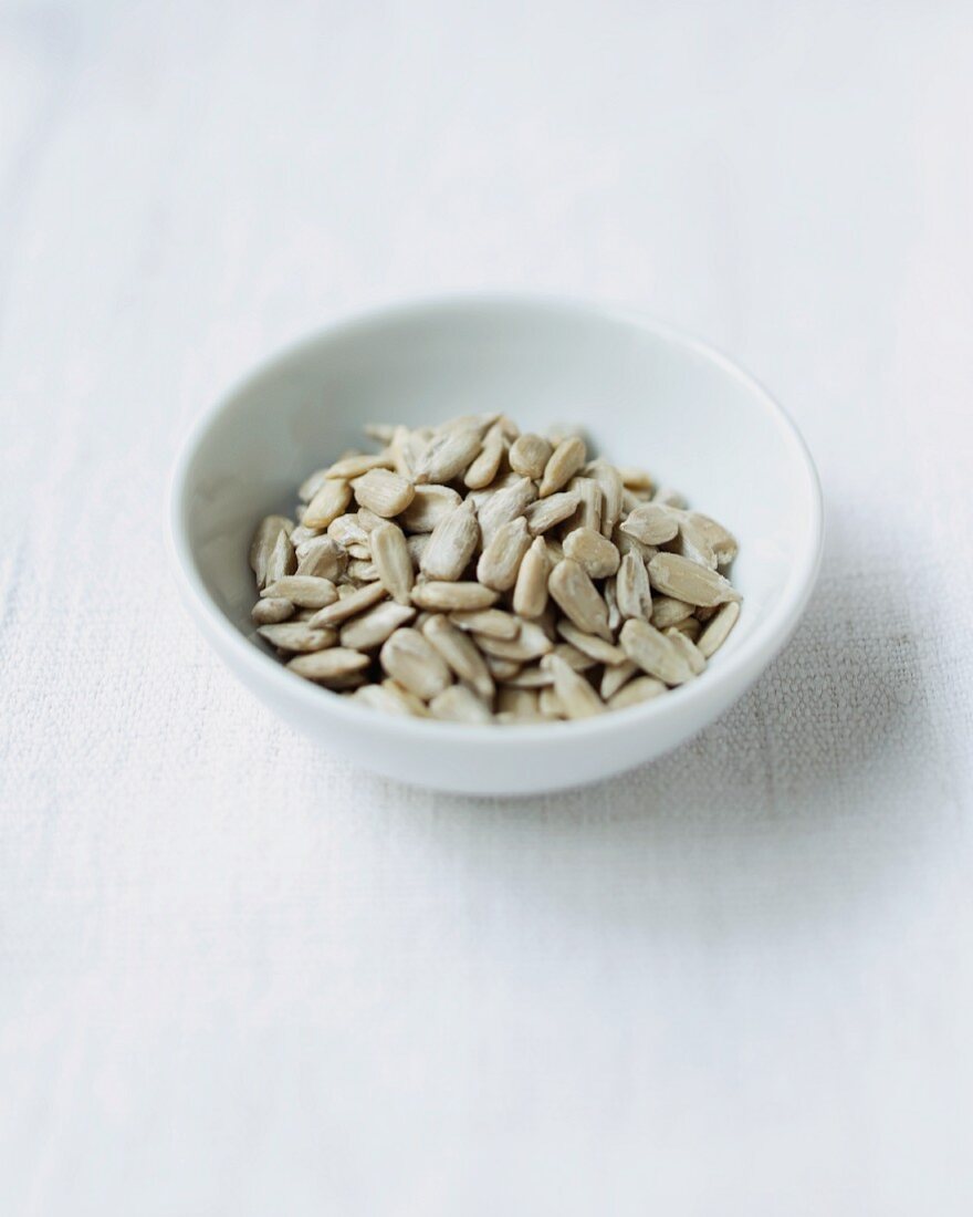 Sunflower seeds in a small dish