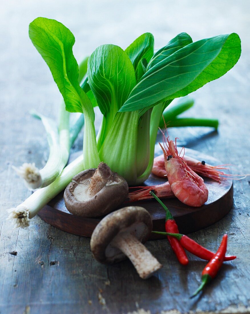 An arrangement of vegetables, mushrooms and prawns