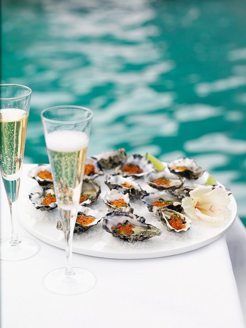 Oysters with salmon caviar