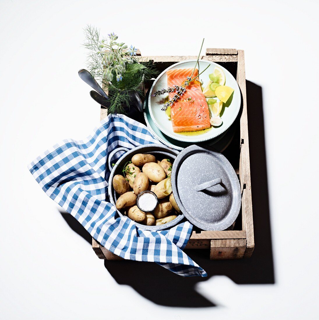 Marinated salmon and new potatoes in a picnic basket