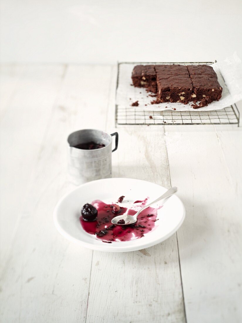 Brownies with cherries (leftovers on a plate)