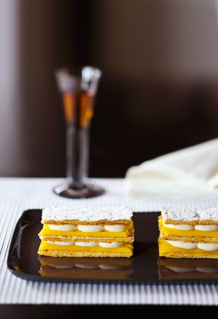 Puff pastry slices filled with mango and vanilla cream