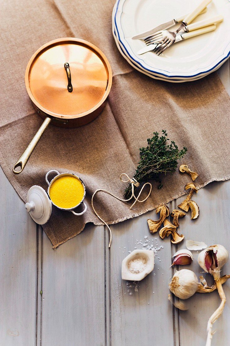 An arrangement of garlic, salt, dried mushrooms and herbs