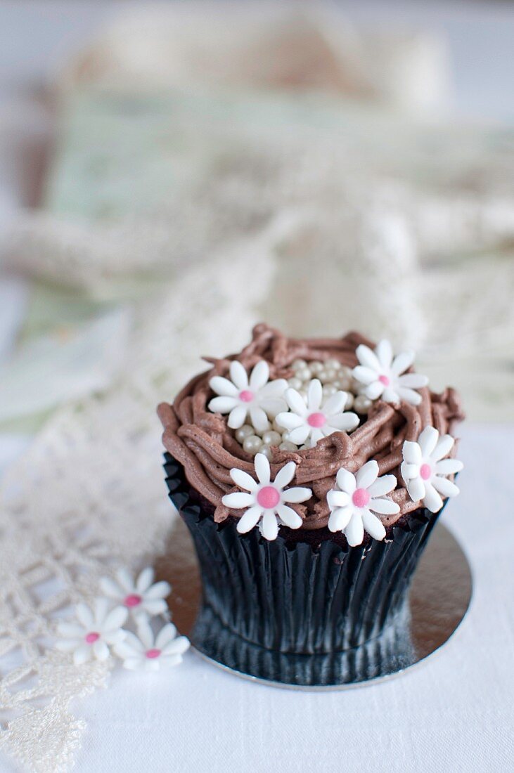 A cupcake decorated with flowers