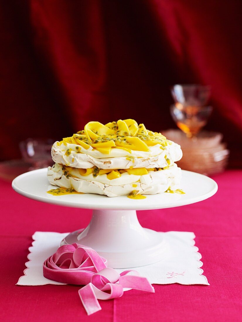 Meringue cake with mango and passion fruit
