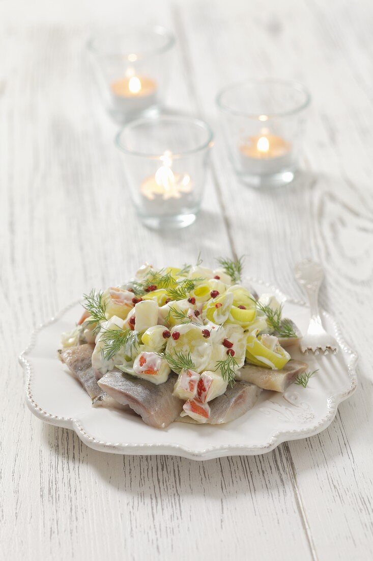 Herring salad with leek, apple, sour cream and red pepper for Christmas