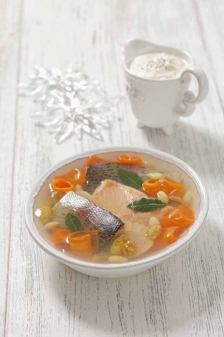 Trout in aspic with carrots, raisins, almonds and horseradish sauce for Christmas