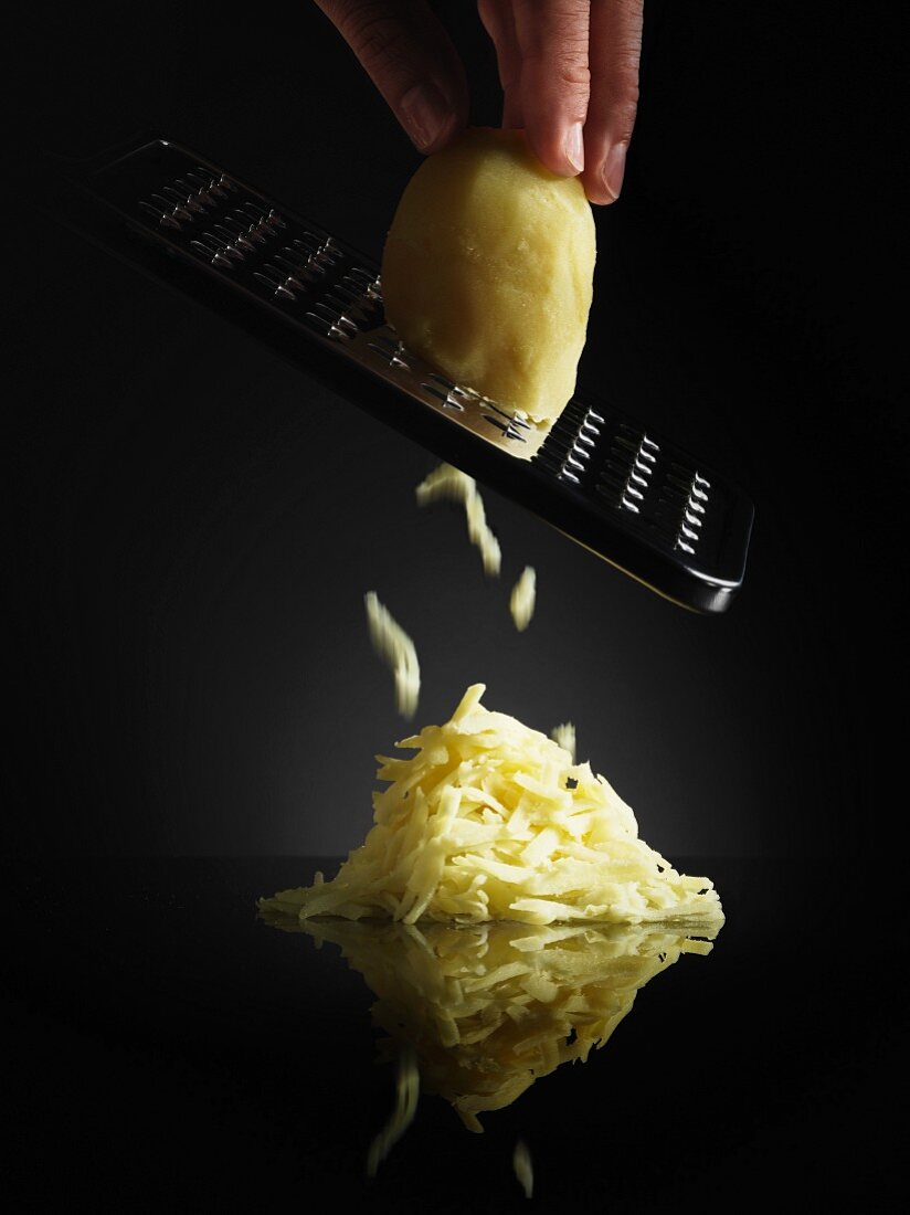 Potato being grated
