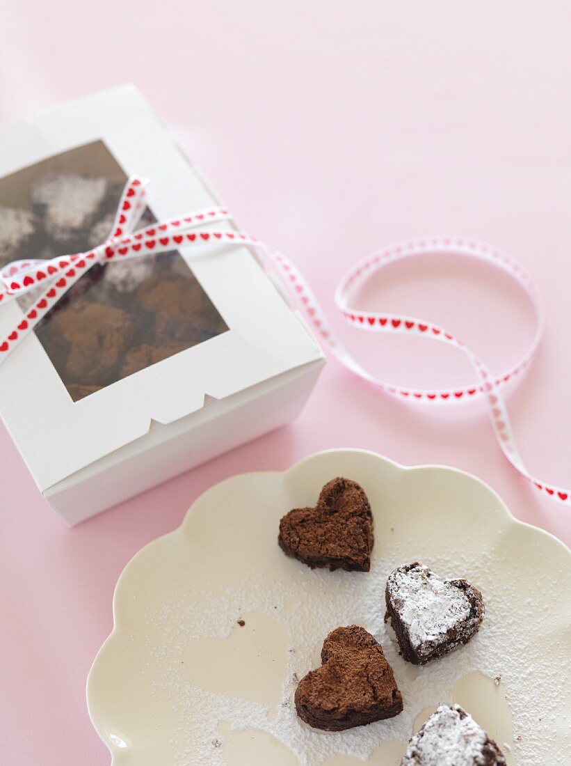 Chocolate hearts on a plate and in a gift box