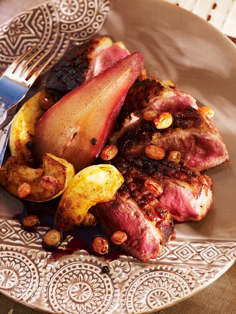Duck breast with roasted fruit and raisin sauce