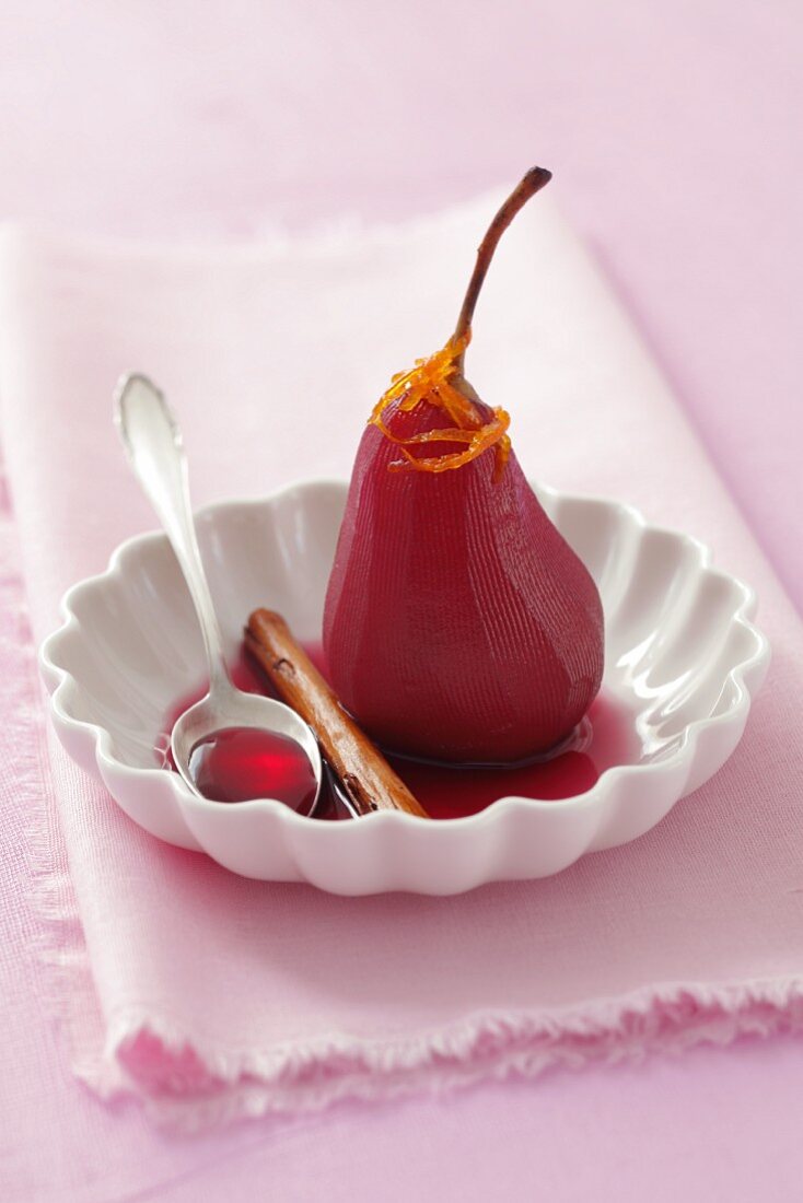 Poached pears in red wine with candied orange zest