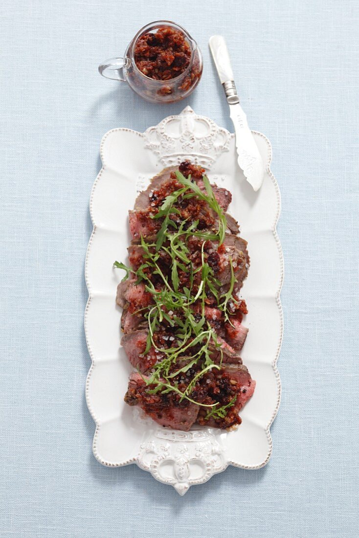 Beef carpaccio with dried tomatoes and a cranberry dressing