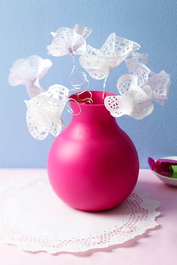 Doily flowers in a rubber vase