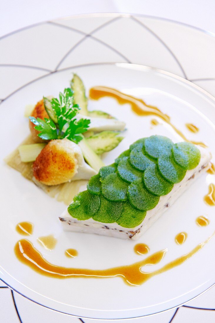 Pollack with slices of herb jelly and asparagus