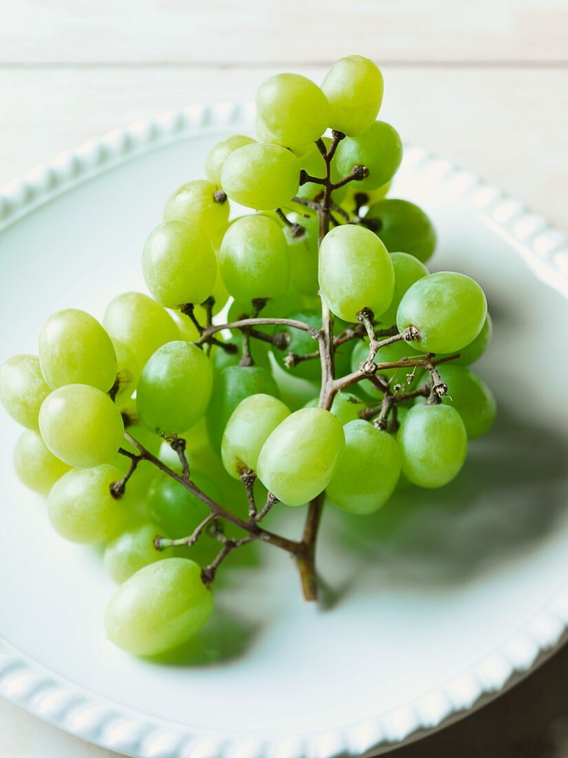 Bunch of Green Grapes on a White Plate