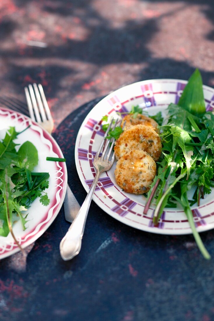 Baked goat's cheese with dandelion salad
