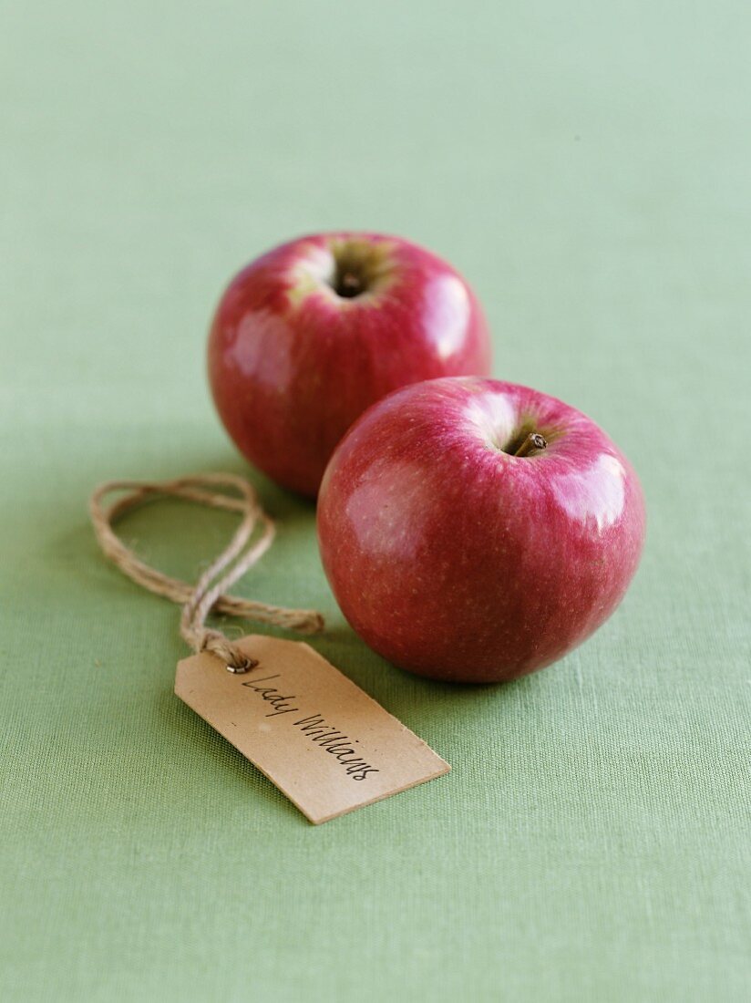 Two Lady Williams apples with a label