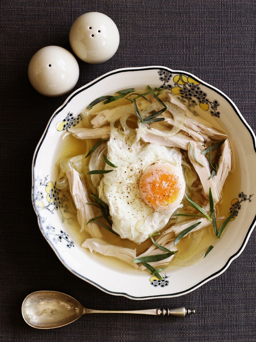 Chicken soup with a poached egg