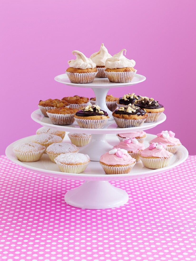 Various cupcakes on a cake stand