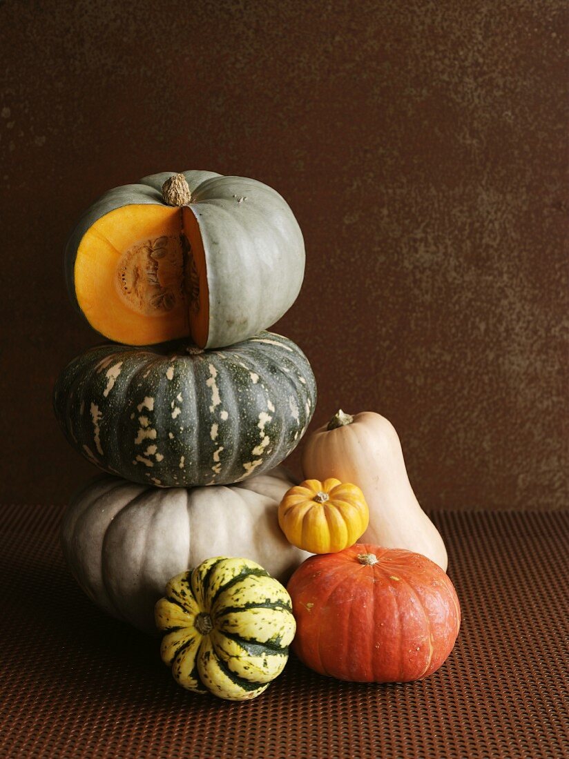 A stack of various pumpkins