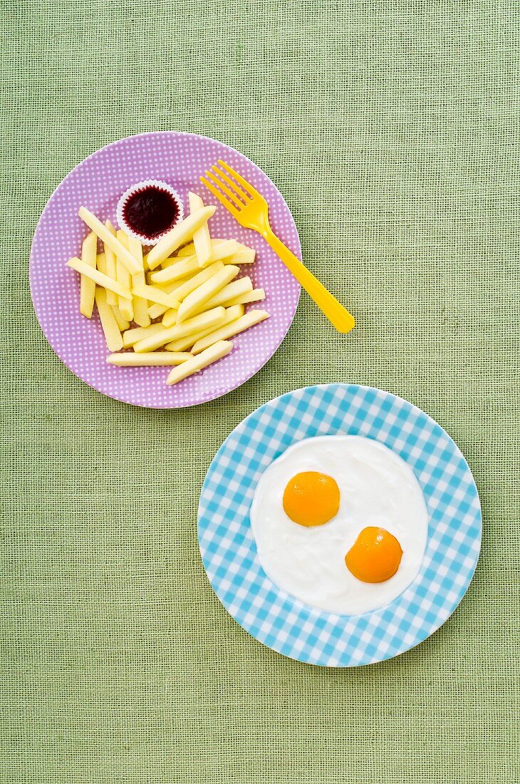 Fried eggs with chips (artistic)