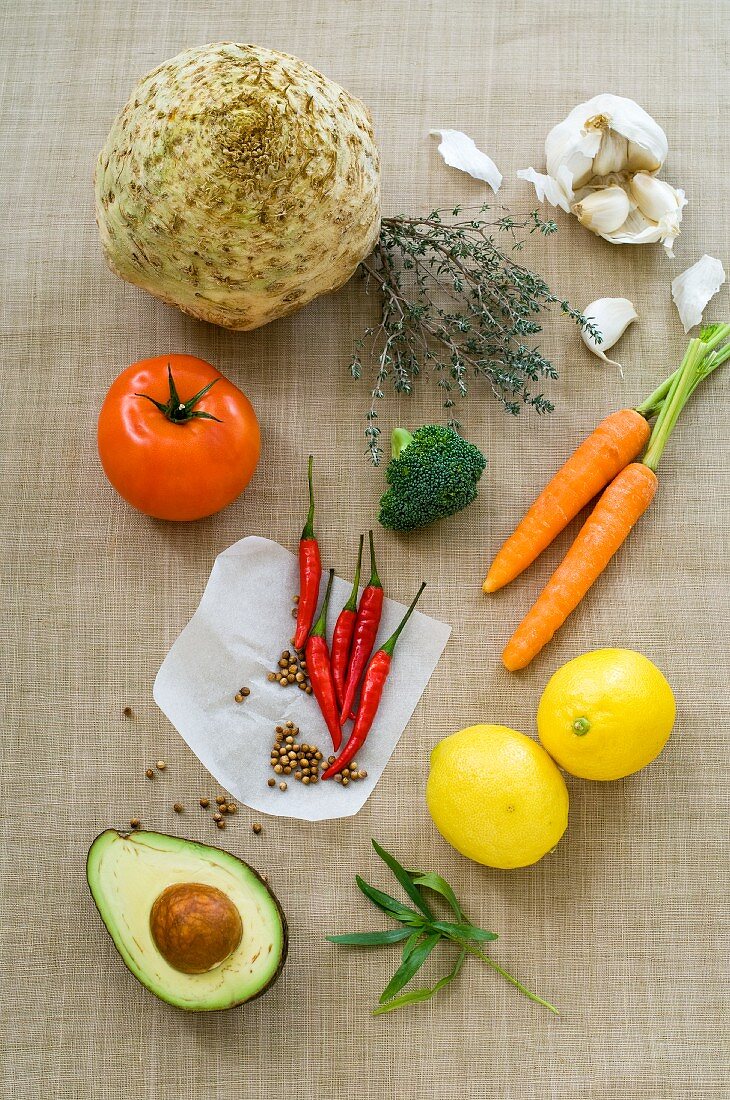 An arrangement of vegetables, herbs, spices and lemons