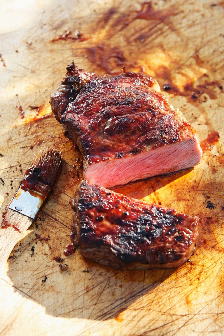 A sliced beef steaks on a chopping board