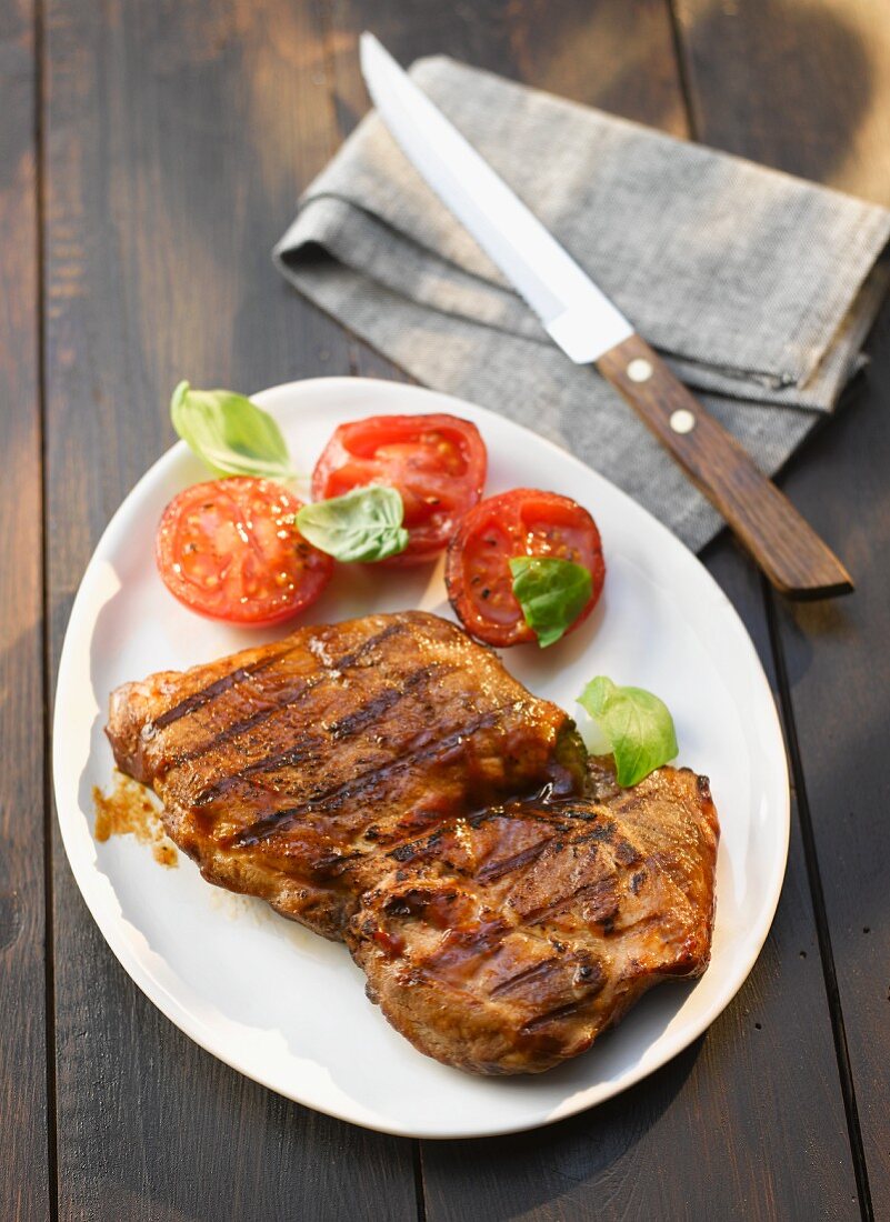 Beef steak with grilled tomatoes
