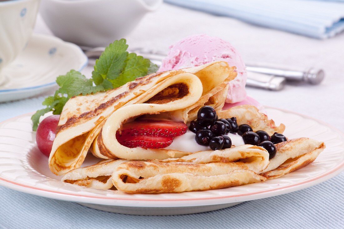 Pancakes with berries and ice cream