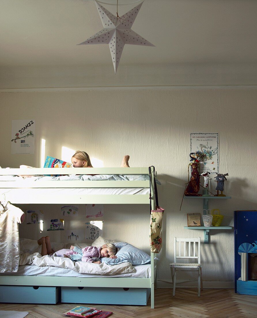 Children in bunk beds in rustic children's bedroom