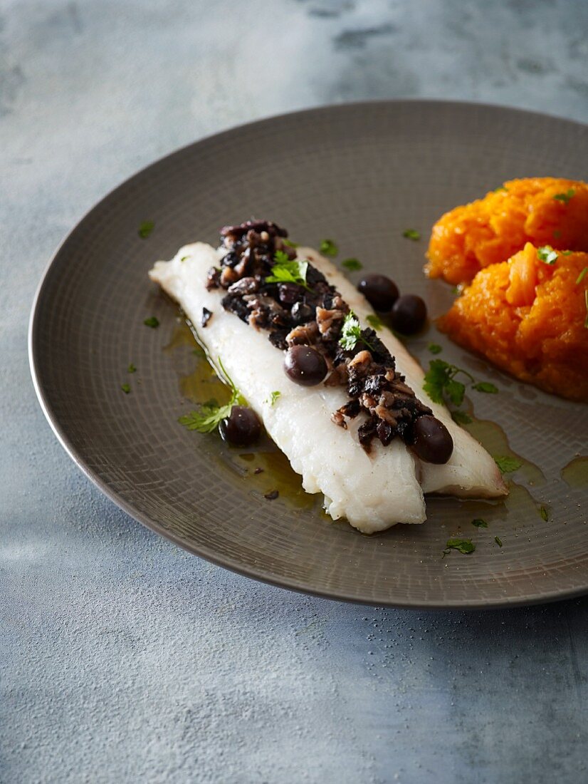 Fish filet with olives, anchovies and pumpkin puree