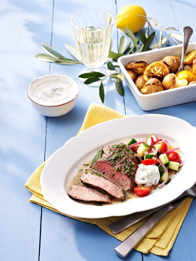 Lamb with lemon potatoes and tzatziki