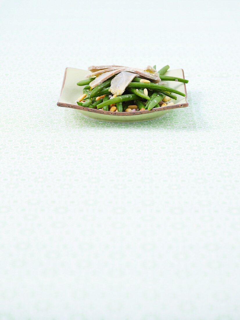 Green bean salad with artichokes and pine nuts