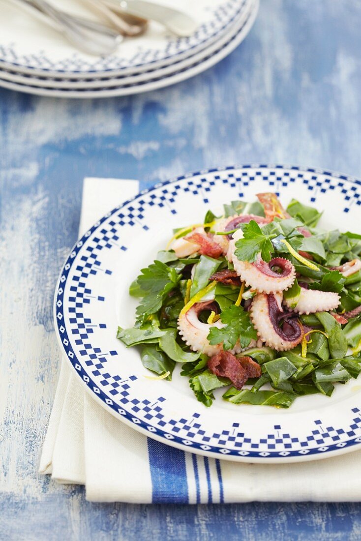 Swiss chard salad with squid and salami