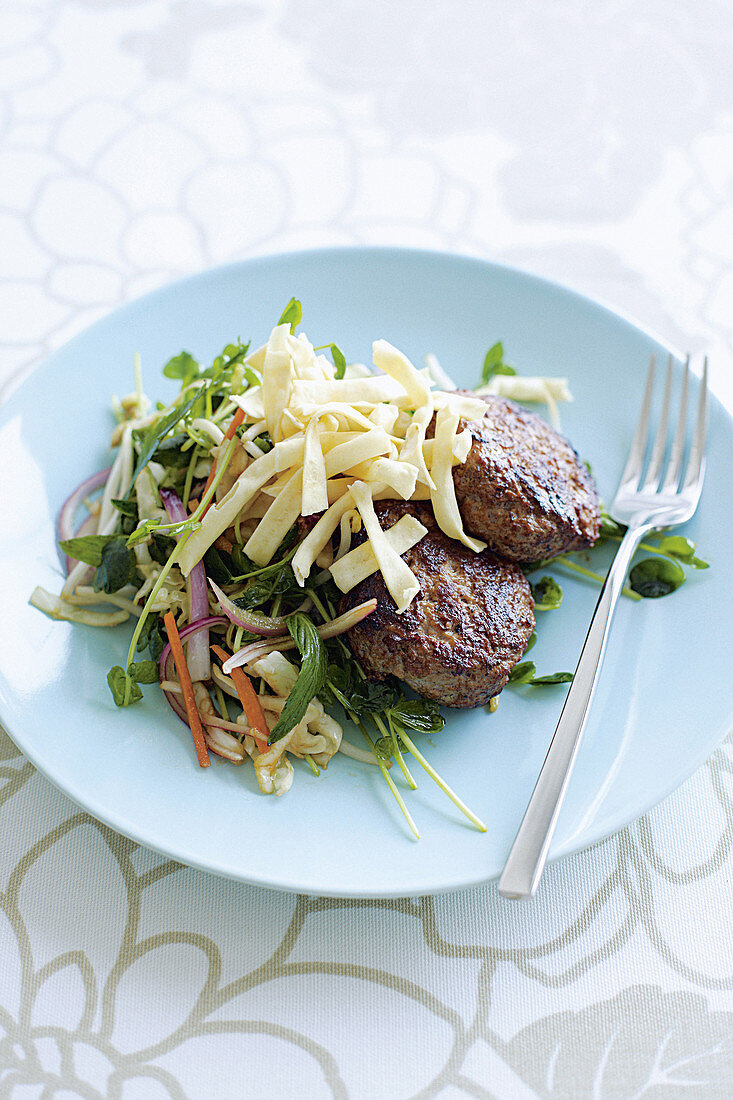 Meat patties with noodles and Chinese cabbage salad