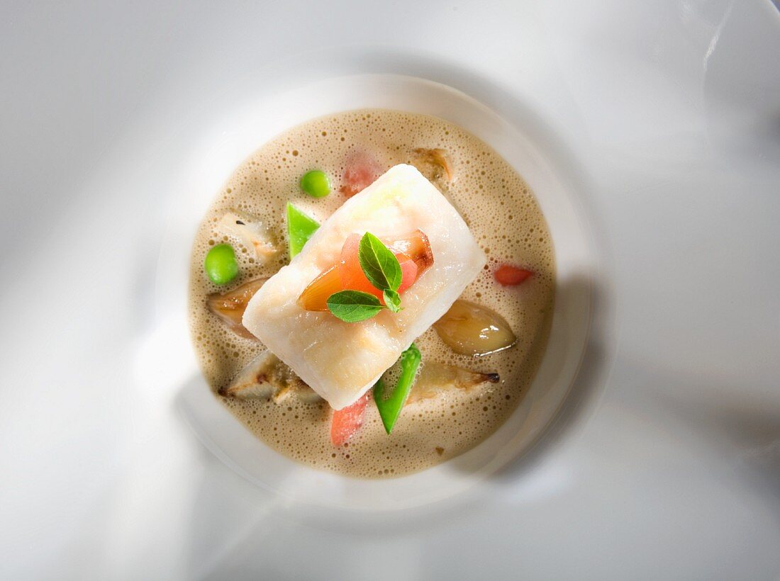 Vegetables foam soup with John Dory