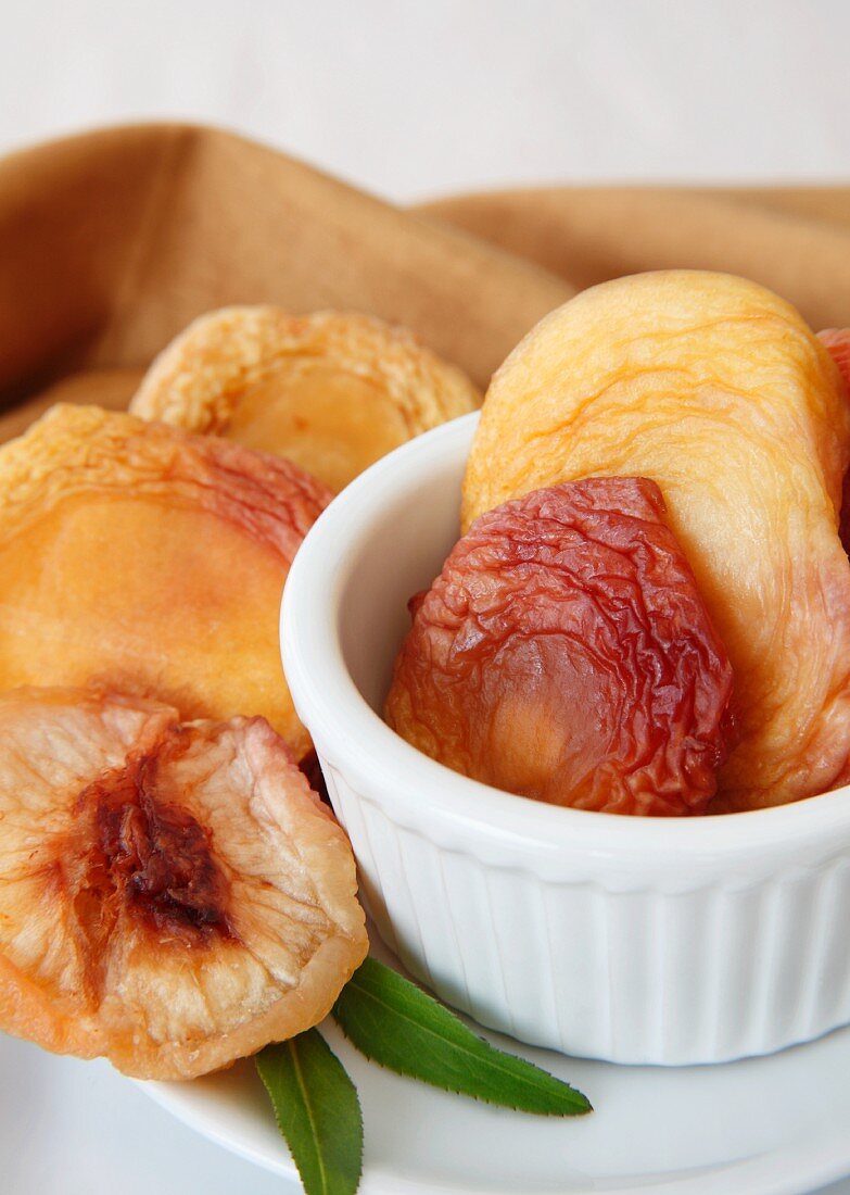 Organic Dried White Peaches in a Small Bowl and Plate