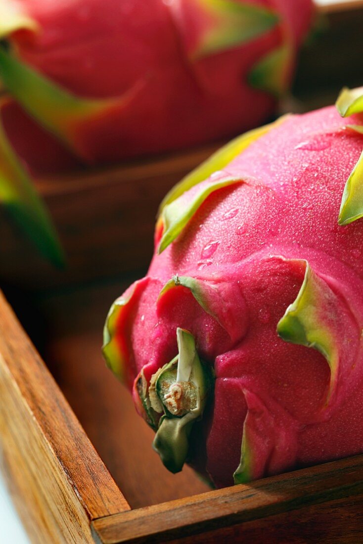 Whole Dragon Fruit in a Wooden Box; Close Up