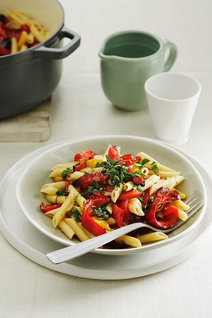Penne pasta with peppers, tomatoes and salsa verde