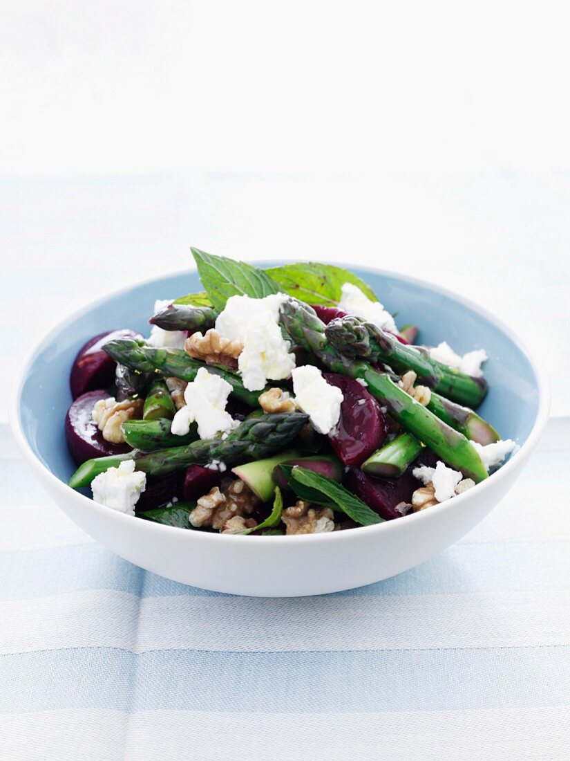 Beetroot salad with green asparagus, feta cheese and walnuts