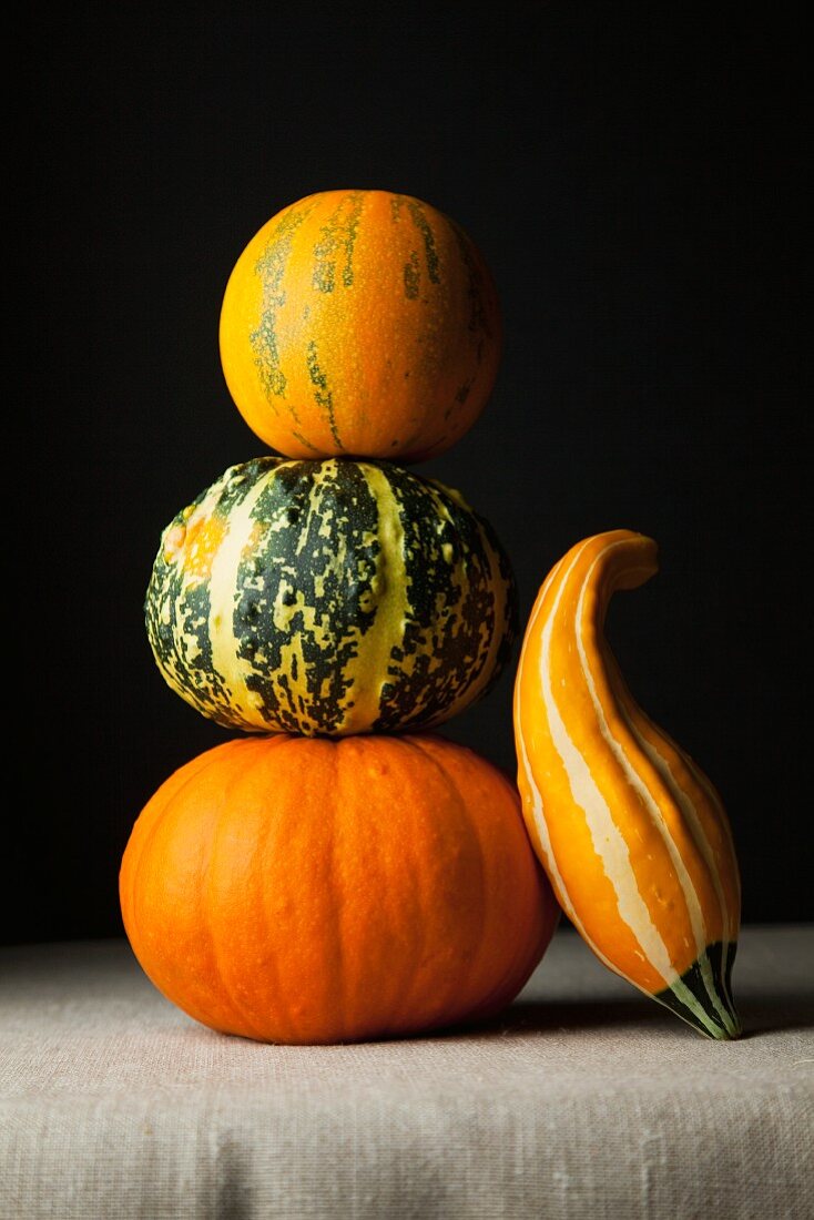 A stack of various pumpkins