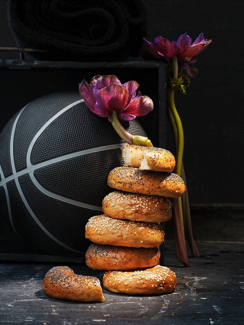 A stack of bagels in front of a basketball