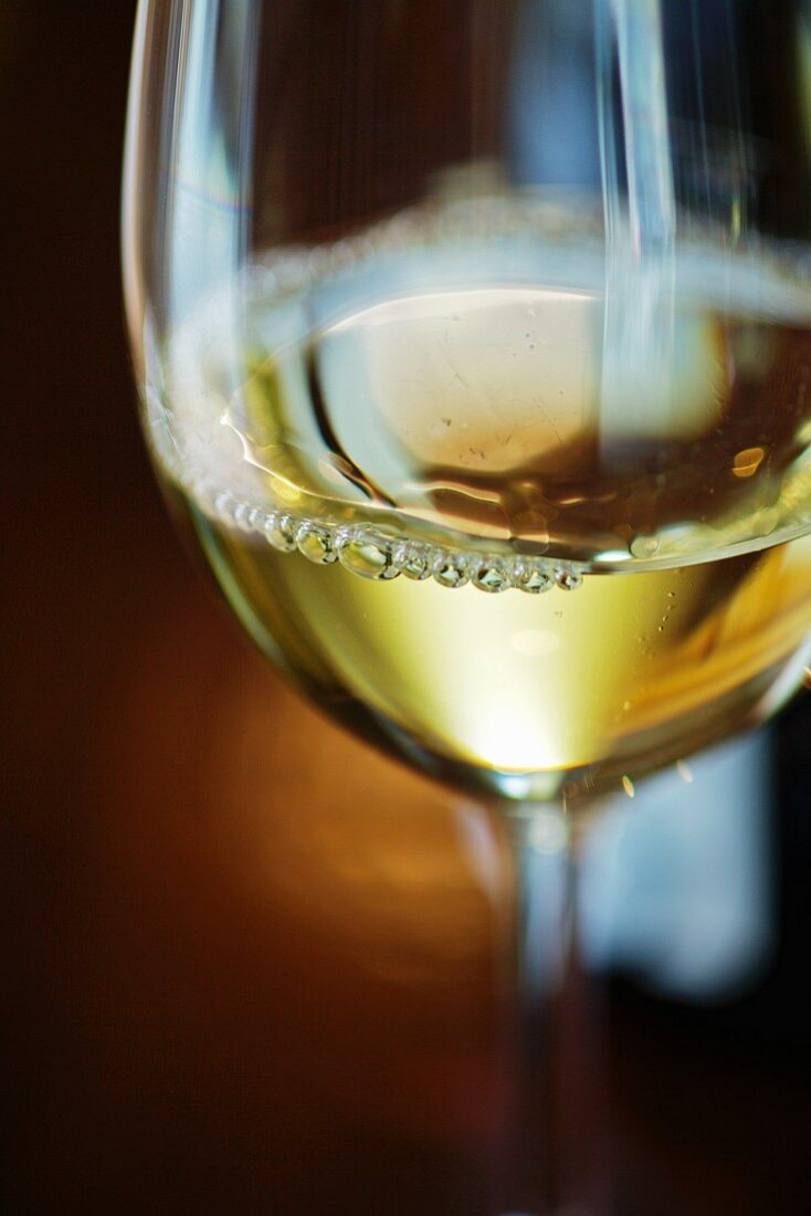 A glass of Green Veltliner wine (close-up)