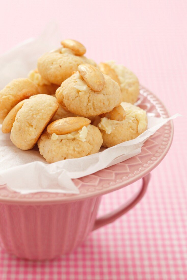 Almond biscuits on a pink plate