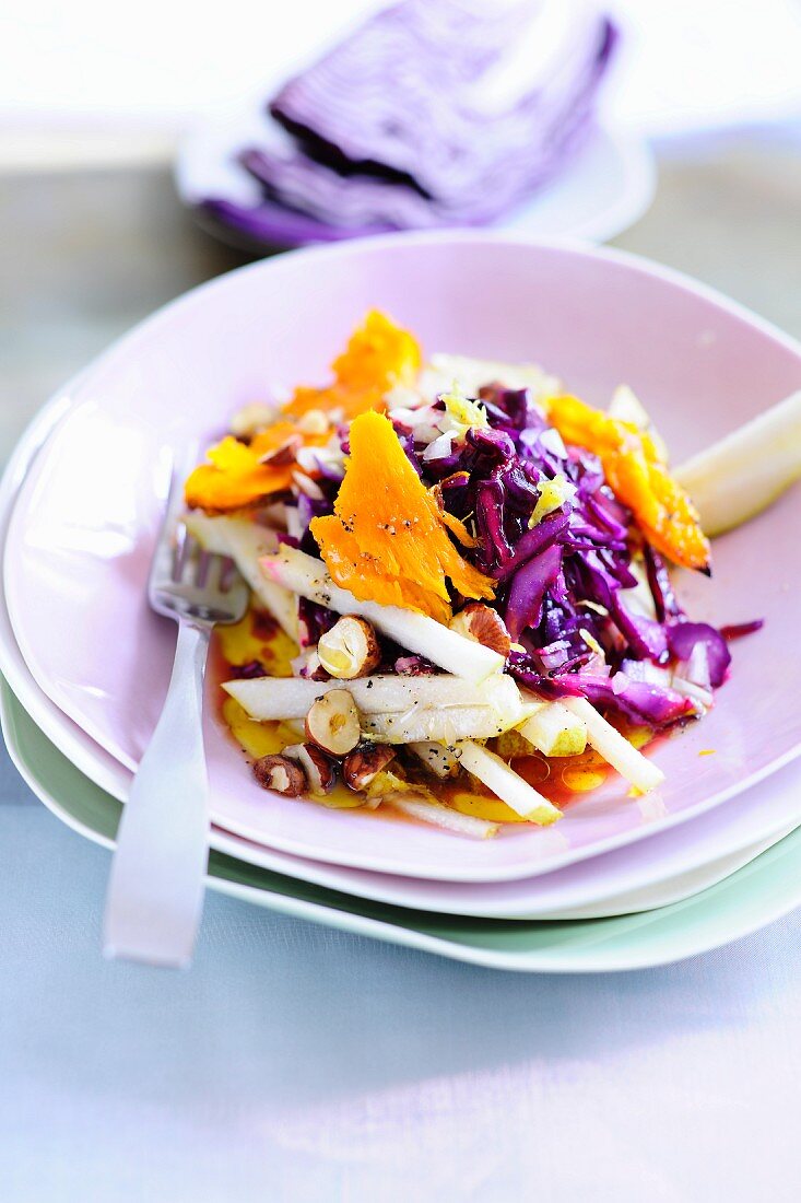 Red cabbage and pear salad with pumpkins and hazelnuts